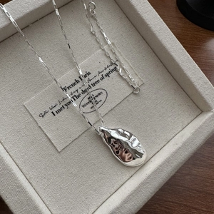 Minimalist S925 silver necklace with an irregular textured pendant and square grid chain