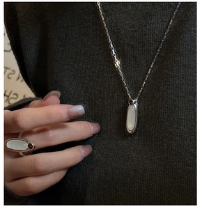 Detailed macro view of S925 sterling silver ring and necklace set with white chalcedony