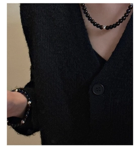 Detail view of S925 silver beaded necklace and bracelet set with black onyx and metal accents