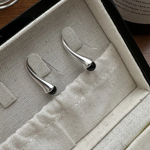 Minimalist S925 sterling silver drop earrings with elegant long cone and black bead