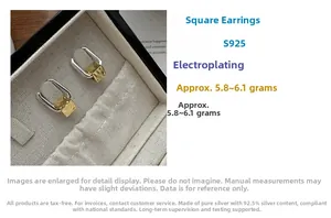 Detail of square two-tone S925 silver earrings with gold matte finish and weight specs