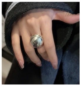 Macro shot of polished S925 sterling silver matte dome ring with minimalist bread-style design