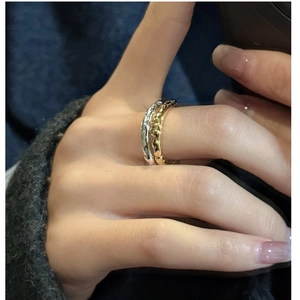 Detail of S925 sterling silver rings featuring a unique textured hammered finish