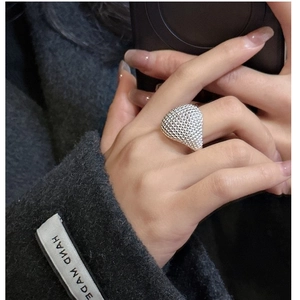 Detailed view of S925 sterling silver beaded ring with textured metallic dots finish