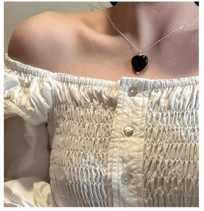 Close-up of heart-shaped black onyx pendant necklace on S925 sterling silver chain