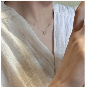 Minimalist S925 silver necklace with irregular natural stone pendant on female neck