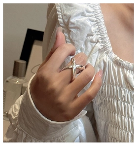 Close-up of S925 sterling silver wide cross ring with modern geometric X-shape design