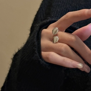 Minimalist S925 sterling silver open ring with dual oval moonstones on a hand