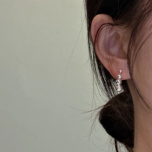 Minimalist 925 sterling silver drop earrings with three gradient spheres on model