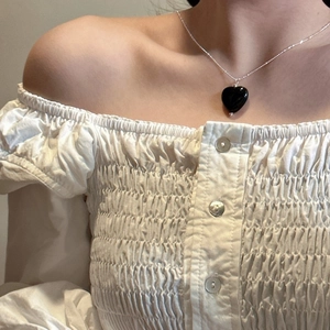 Minimalist S925 sterling silver necklace with black agate heart pendant on woman neck
