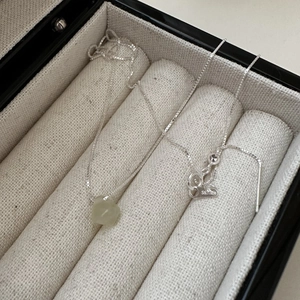 S925 sterling silver necklace with a geometric light green natural stone in a jewelry box
