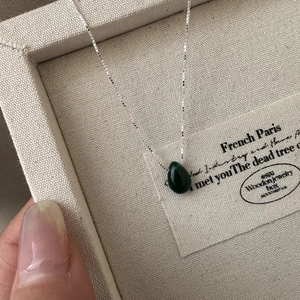 Elegant S925 sterling silver necklace with a dark green teardrop pendant on a silver box chain