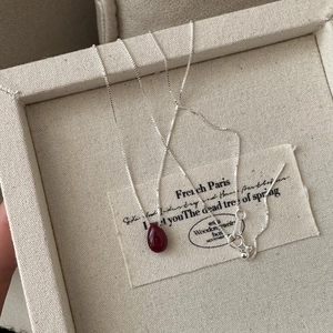 S925 sterling silver necklace with teardrop red stone in a vintage jewelry box