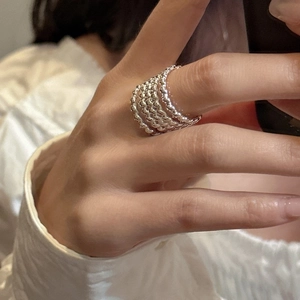 Detail of S925 sterling silver multi-layer beaded ring with vintage textured finish