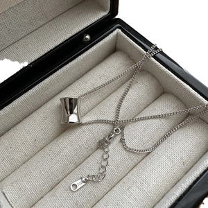 Elegant S925 sterling silver cylinder necklace displayed inside a black jewelry box