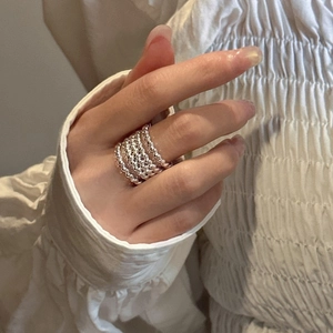 Minimalist S925 sterling silver multi-layer beaded ring stack on a model's finger