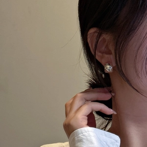 Minimalist 925 sterling silver C-shaped earrings with hammered texture finish on model