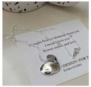 Detailed view of S925 sterling silver heart pendant with authentic S925 hallmark stamp