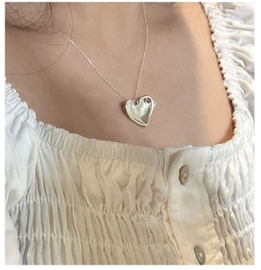Close-up of a high-polished S925 sterling silver heart pendant necklace for women
