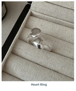 Detailed close-up of S925 sterling silver double heart ring in a luxury jewelry box