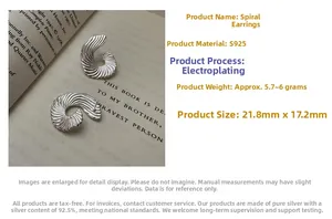 Detailed view of S925 sterling silver fan-shaped earrings with shell-like texture and spiral design