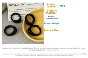 Close-up of minimalist black polished agate style ring with smooth rounded design