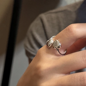 Minimalist S925 sterling silver open ring featuring double heart design on hand