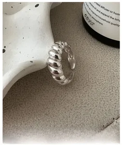 Macro view of S925 sterling silver croissant ring showing twist texture and S925 hallmark