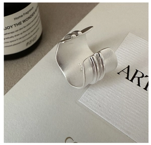 Macro view of S925 sterling silver stamp on minimalist matte wide band ring