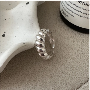 Macro shot of S925 sterling silver croissant ring showing the fine hallmark stamp