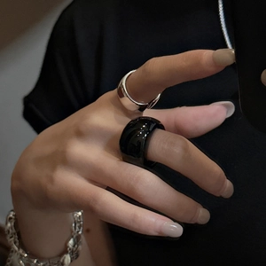 Minimalist stackable wide rings in silver and black finish with a chunky chain bracelet