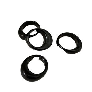 Set of four minimalist glossy black resin rings with asymmetric thick round band design