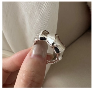 Close-up of S925 sterling silver ring with irregular liquid melt texture design