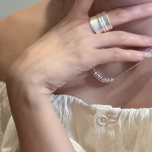 Minimalist S925 sterling silver wide matte ring and necklace set worn by a female model