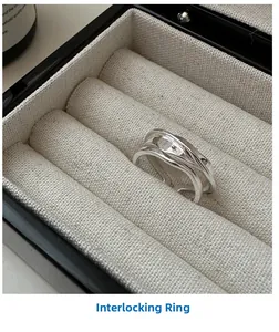 Macro shot of minimalist S925 sterling silver multilayered crisscross ring in a jewelry box