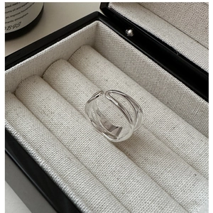 Macro shot of silver S925 minimalist double wave ring set in a premium jewelry box