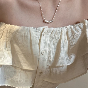 Minimalist S925 sterling silver necklace with spiral ring pendants on a female model