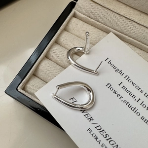 Minimalist S925 sterling silver hoop earrings with irregular twisted water drop design