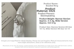 Detail of S925 sterling silver multilayer ring with beads on minimalist ceramic plate