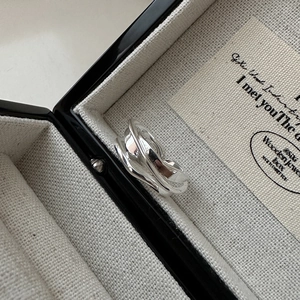 Minimalist S925 sterling silver irregular wavy ring displayed in a black premium jewelry box