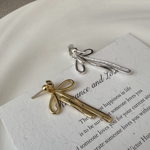 Elegant S925 sterling silver bow earrings in gold and silver finish with polished texture