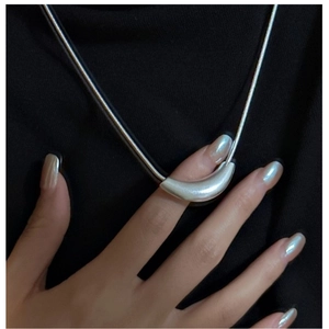 Detail of S925 sterling silver curved bar pendant with matte finish on black cord