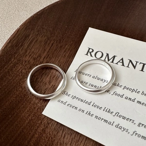 Minimalist S925 sterling silver matte rings on vintage wood tray and poetic card