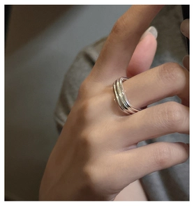 Close-up of a stacked multi-layer S925 sterling silver square ring on a finger