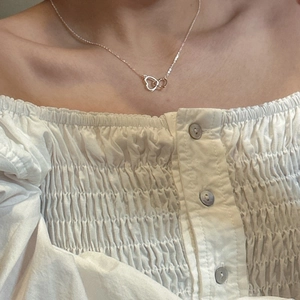 S925 sterling silver interlocking heart necklace worn on neck in rose gold finish