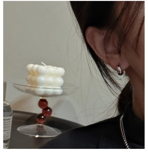 Minimalist S925 sterling silver curved hoop earring worn on model for a sleek look