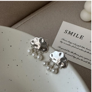 Close-up of S925 silver cloud earrings featuring three hanging pearls as rain droplets