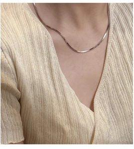 Minimalist 925 sterling silver snake chain necklace worn on collarbone with casual wear