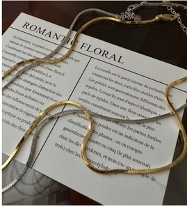 Detail of S925 sterling silver square snake chains in gold and silver with lobster clasp