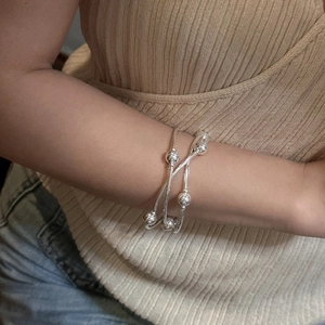 Minimalist S925 sterling silver triple-layer beaded bracelet worn on a female wrist